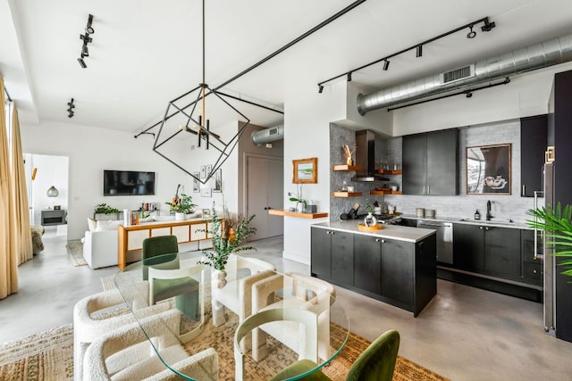 800 W 5th St Unit 902, Austin, TX 78703 - dining space featuring rail lighting, concrete floors, and a chandelier