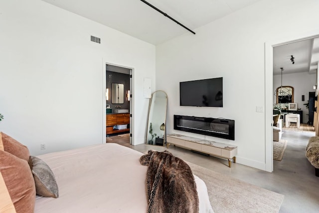 800 W 5th St Unit 902, Austin, TX 78703 - bedroom with finished concrete floors and baseboards