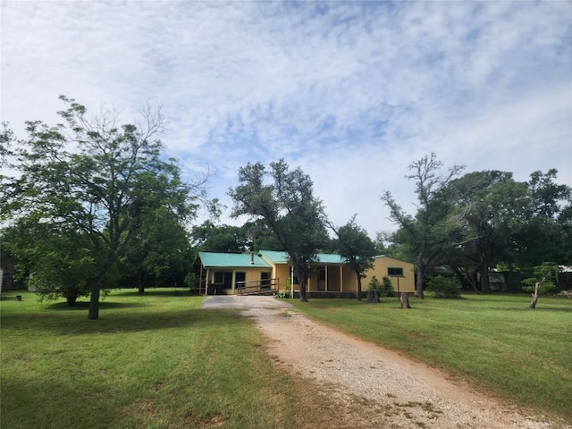 515 Country Ln, Buda, TX 78610 - view of front of home featuring dirt driveway and a front yard