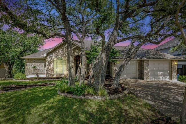 9010 Bluegrass Dr, Austin, TX 78759 - view of front of house with an attached garage, a front yard, and concrete driveway
