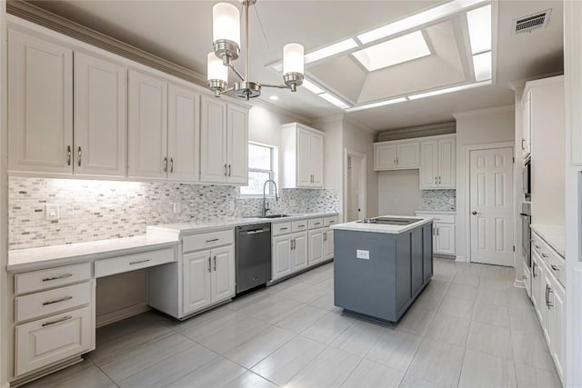 9010 Bluegrass Dr, Austin, TX 78759 - kitchen with appliances with stainless steel finishes, ornamental molding, a sink, tasteful backsplash, and white cabinetry