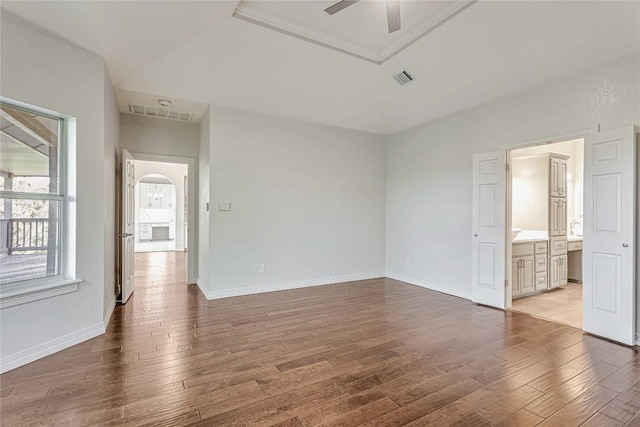 9010 Bluegrass Dr, Austin, TX 78759 - empty room featuring a ceiling fan, light wood-style flooring, arched walkways, and baseboards