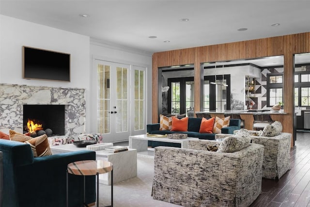 102 Crestwood Ct, Austin, TX 78746 - living room featuring french doors, wood finished floors, healthy amount of natural light, and a high end fireplace
