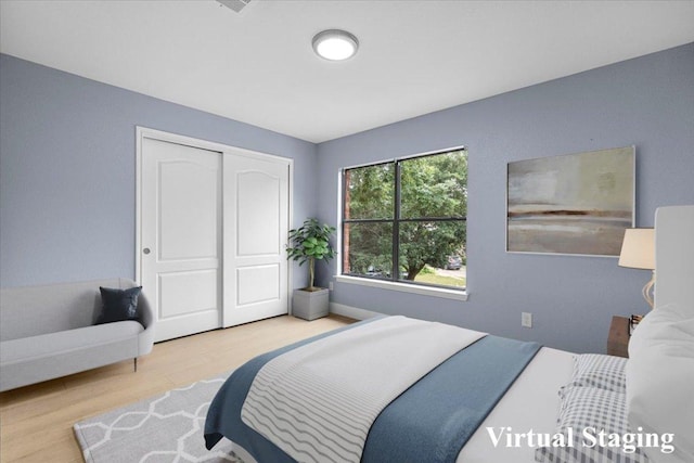 1222 Minerva St, Austin, TX 78753 - bedroom featuring wood finished floors and a closet