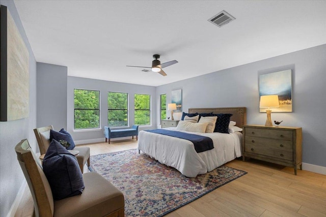 1222 Minerva St, Austin, TX 78753 - bedroom featuring wood finished floors, baseboards, and ceiling fan