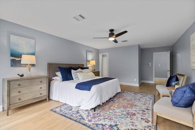 1222 Minerva St, Austin, TX 78753 - bedroom featuring light wood finished floors, baseboards, and a ceiling fan