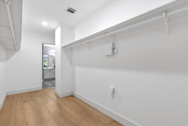 1222 Minerva St, Austin, TX 78753 - walk in closet featuring light wood-style floors