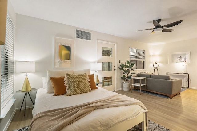 2000 Glen Allen St Unit 2, Austin, TX 78704 - bedroom featuring baseboards, wood finished floors, and a ceiling fan