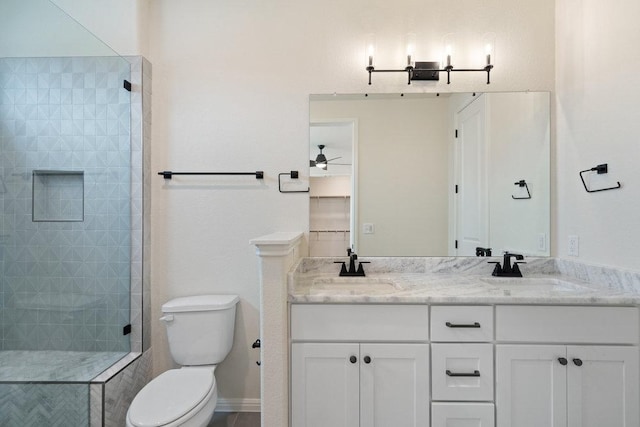 2008 Kit Cir, Austin, TX 78758 - full bathroom with toilet, a shower stall, double vanity, and ceiling fan