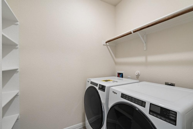 2008 Kit Cir, Austin, TX 78758 - laundry room featuring washer and clothes dryer and baseboards