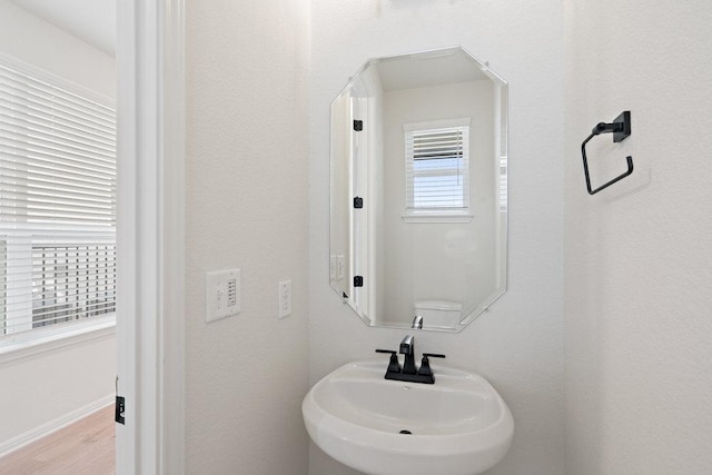 2008 Kit Cir, Austin, TX 78758 - bathroom featuring a sink and wood finished floors