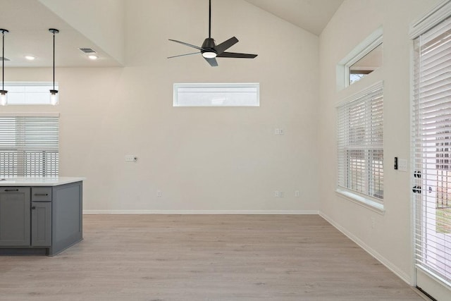 2008 Kit Cir, Austin, TX 78758 - unfurnished dining area featuring ceiling fan, light wood-type flooring, high vaulted ceiling, baseboards, and recessed lighting