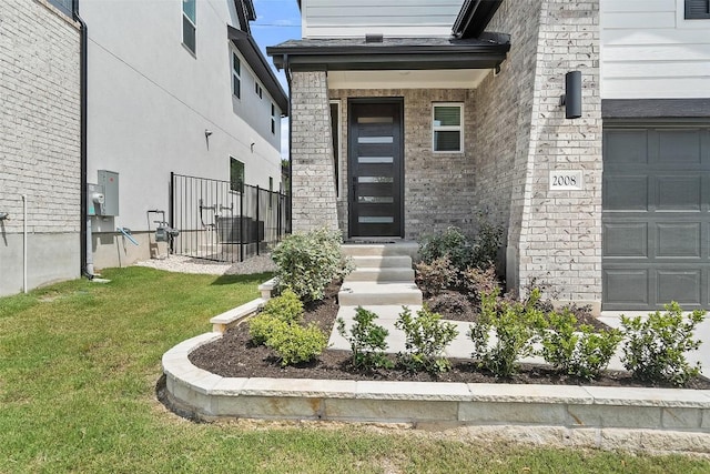 2008 Kit Cir, Austin, TX 78758 - view of exterior entry with a garage and brick siding