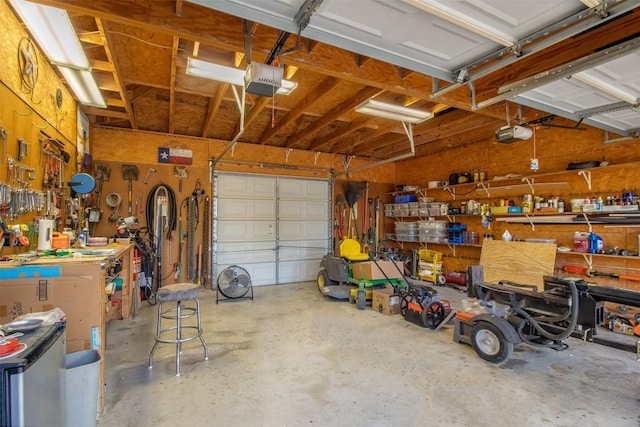4671 Fischer Store Rd, Wimberley, TX 78676 - garage with a workshop area and a garage door opener