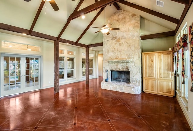 4671 Fischer Store Rd, Wimberley, TX 78676 - unfurnished living room with ceiling fan, high vaulted ceiling, a stone fireplace, beam ceiling, and tile patterned flooring