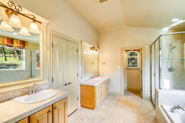 4671 Fischer Store Rd, Wimberley, TX 78676 - full bath with lofted ceiling, a shower stall, two vanities, tile patterned flooring, and a relaxing tiled tub