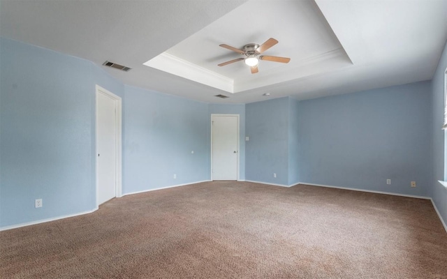 3907 Sojourner St, Austin, TX 78725 - unfurnished room with ceiling fan, a raised ceiling, carpet floors, and baseboards