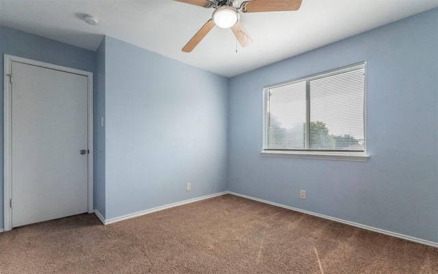 3907 Sojourner St, Austin, TX 78725 - empty room with carpet floors, ceiling fan, a smoke detector, and baseboards