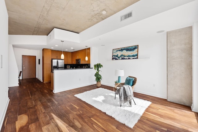 360 Nueces St Unit 1407, Austin, TX 78701 - sitting room with dark wood-style floors and baseboards