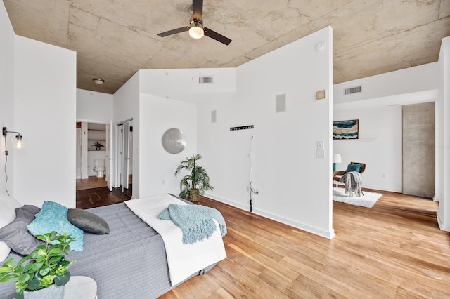 360 Nueces St Unit 1407, Austin, TX 78701 - living area featuring ceiling fan, light wood-style floors, and baseboards
