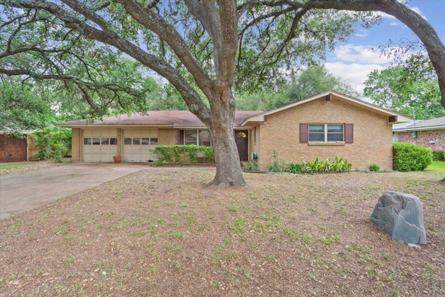 4412 Briar Cliff Rd, Temple, TX 76502 - ranch-style house featuring brick siding, a garage, and driveway