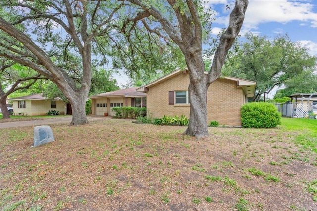 4412 Briar Cliff Rd, Temple, TX 76502 - view of front facade featuring a garage and brick siding