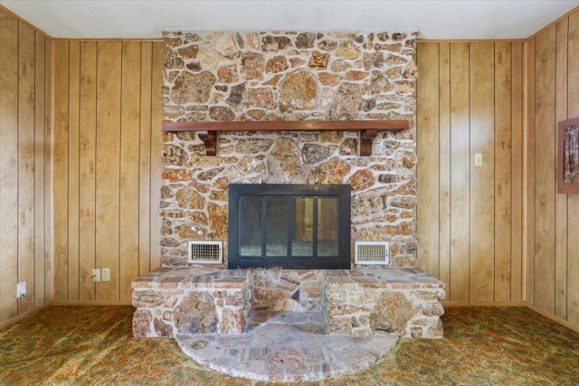 4412 Briar Cliff Rd, Temple, TX 76502 - detailed view of wood walls, baseboards, and a stone fireplace