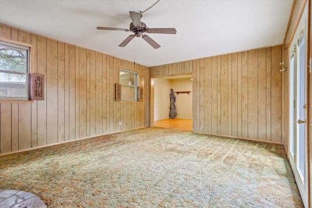 4412 Briar Cliff Rd, Temple, TX 76502 - unfurnished room featuring ceiling fan, carpet, and wood walls