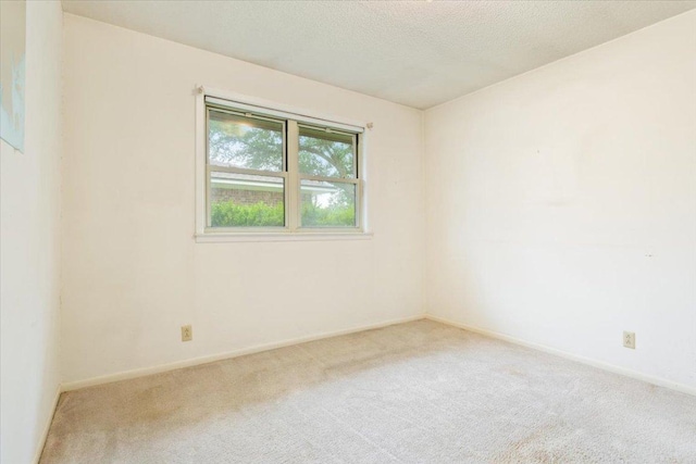 4412 Briar Cliff Rd, Temple, TX 76502 - empty room with carpet floors, baseboards, and a textured ceiling