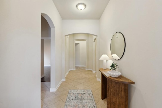 2944 Castellan Ln, Round Rock, TX 78665 - hallway featuring arched walkways and light tile patterned floors