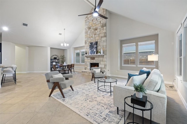 2944 Castellan Ln, Round Rock, TX 78665 - living room featuring a ceiling fan, light tile patterned floors, high vaulted ceiling, a stone fireplace, and plenty of natural light