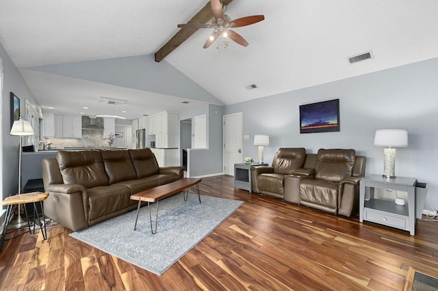 2009 S Oak Canyon Rd, Austin, TX 78746 - living room featuring a ceiling fan, wood finished floors, beam ceiling, baseboards, and high vaulted ceiling
