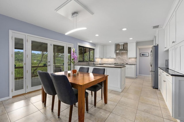 2009 S Oak Canyon Rd, Austin, TX 78746 - dining room featuring baseboards, french doors, light tile patterned floors, and recessed lighting