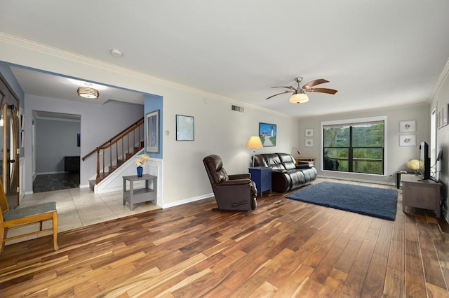 2009 S Oak Canyon Rd, Austin, TX 78746 - living room with wood finished floors, stairs, ceiling fan, ornamental molding, and baseboards