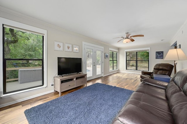 2009 S Oak Canyon Rd, Austin, TX 78746 - living room with french doors, wood finished floors, crown molding, and baseboards
