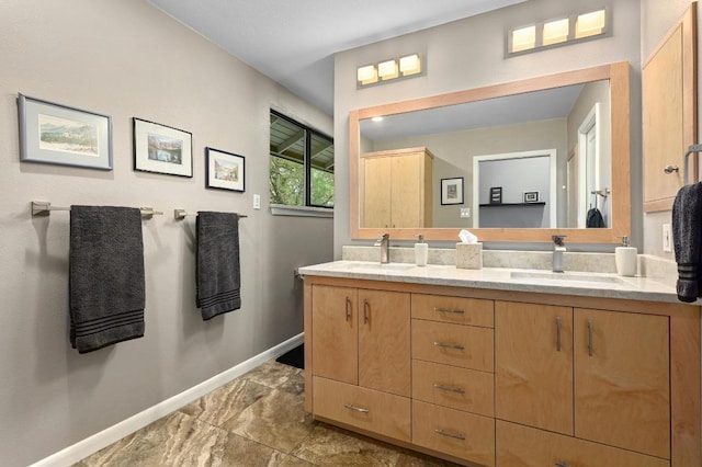 2009 S Oak Canyon Rd, Austin, TX 78746 - full bathroom with baseboards and double vanity
