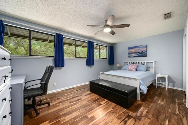 2009 S Oak Canyon Rd, Austin, TX 78746 - bedroom with wood finished floors, a textured ceiling, a desk, baseboards, and a ceiling fan