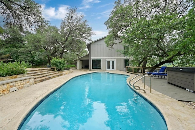 2009 S Oak Canyon Rd, Austin, TX 78746 - swimming pool with a wooden deck and french doors