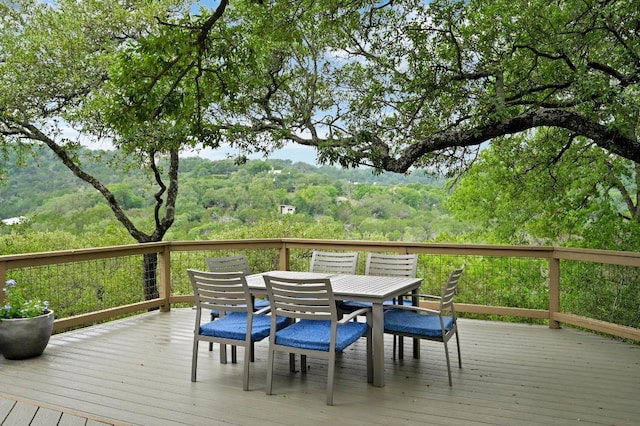 2009 S Oak Canyon Rd, Austin, TX 78746 - wooden terrace featuring outdoor dining space and a forest view