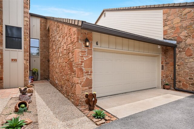 107 Lachite Unit 6, Horseshoe Bay, TX 78657 - garage with concrete driveway