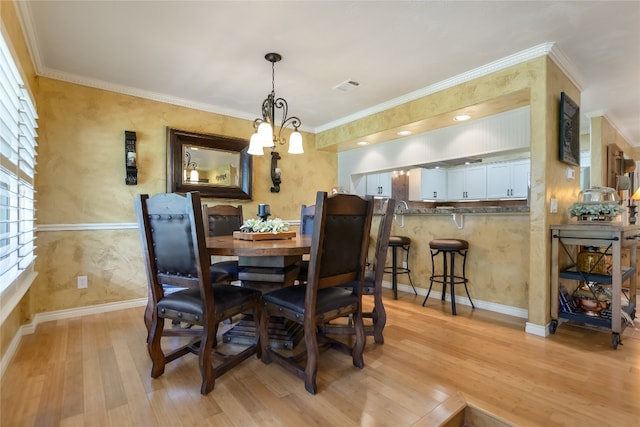 107 Lachite Unit 6, Horseshoe Bay, TX 78657 - dining room with light wood-style flooring, crown molding, and baseboards