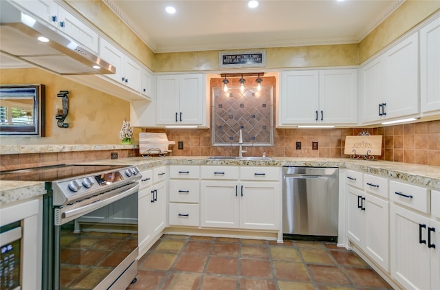 107 Lachite Unit 6, Horseshoe Bay, TX 78657 - kitchen featuring appliances with stainless steel finishes, under cabinet range hood, a sink, white cabinetry, and decorative backsplash
