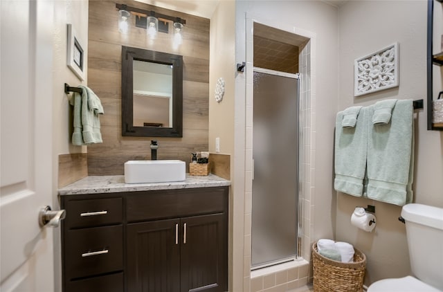 107 Lachite Unit 6, Horseshoe Bay, TX 78657 - full bathroom featuring a shower stall, toilet, and vanity