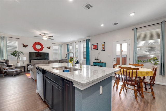 109 Red Cedar Ct, Georgetown, TX 78628 - kitchen with a sink, dishwasher, a ceiling fan, wood finished floors, and open floor plan