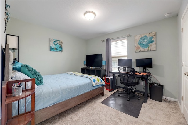 109 Red Cedar Ct, Georgetown, TX 78628 - bedroom with carpet floors, a desk, and baseboards