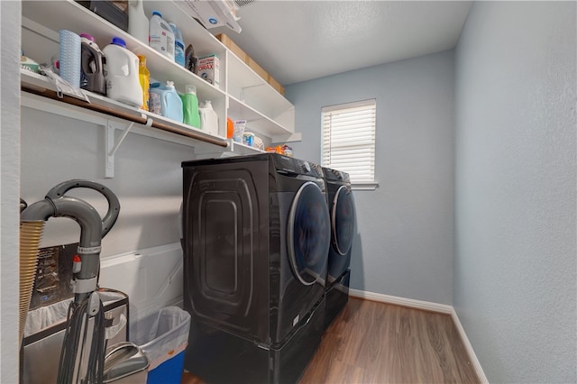 109 Red Cedar Ct, Georgetown, TX 78628 - washroom with washer and clothes dryer, baseboards, and wood finished floors