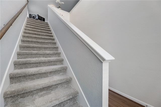 109 Red Cedar Ct, Georgetown, TX 78628 - staircase with baseboards and wood finished floors