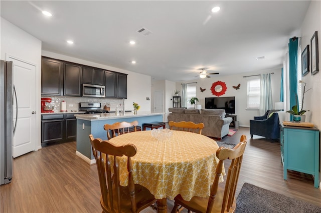 109 Red Cedar Ct, Georgetown, TX 78628 - dining area featuring dark wood-style floors, ceiling fan, and recessed lighting