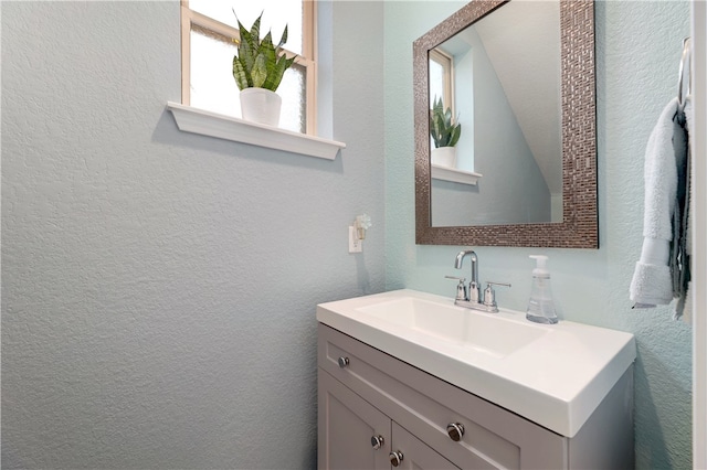 109 Red Cedar Ct, Georgetown, TX 78628 - bathroom with vanity and a textured wall