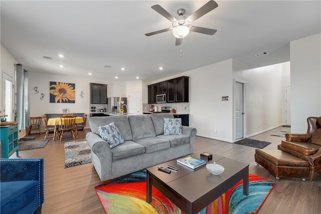 109 Red Cedar Ct, Georgetown, TX 78628 - living area featuring light wood-type flooring, a ceiling fan, recessed lighting, and baseboards